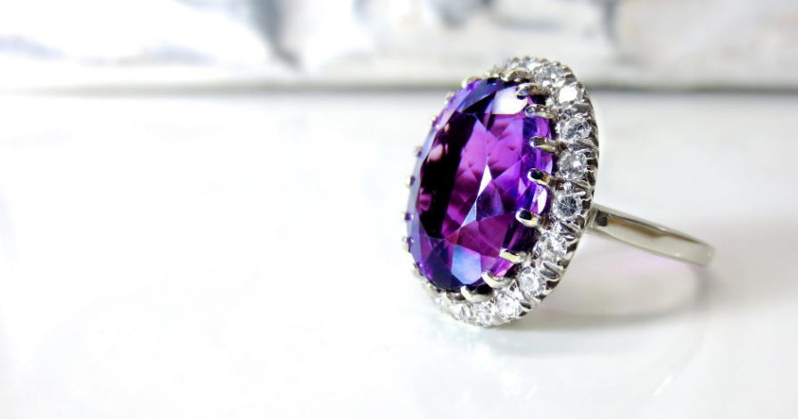 a ring with purple diamond